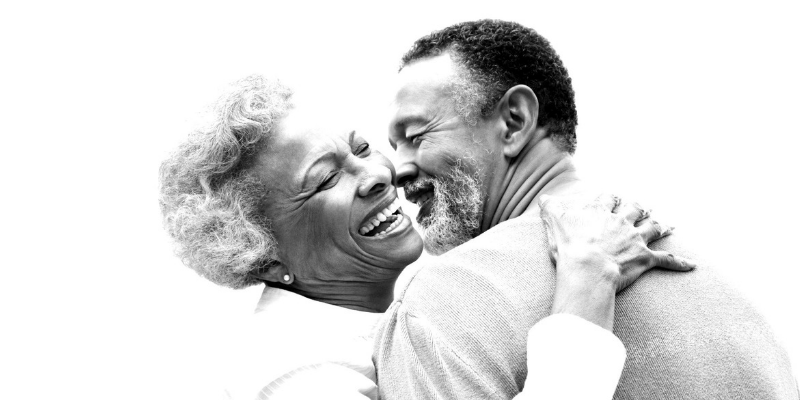 Two people embracing and laughing together