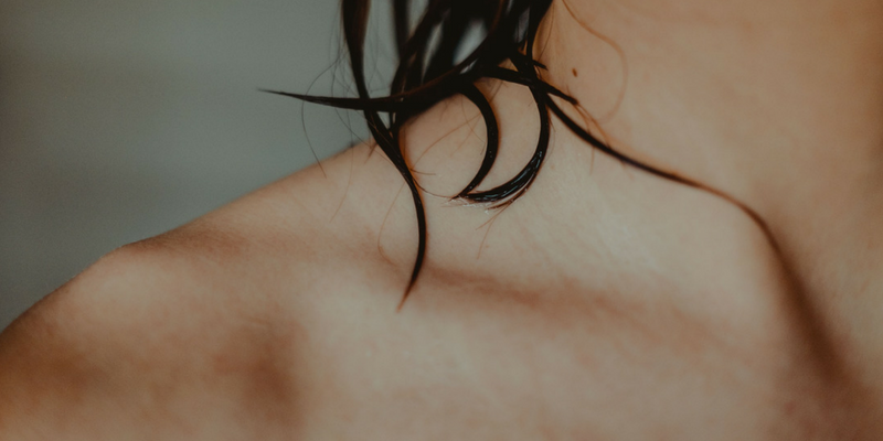 Close-up image of a person's collar bone